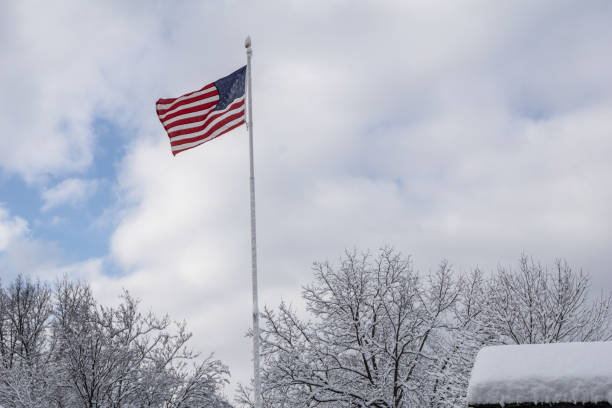 istock American Flag Flies over Snowy Landscape 1891134808