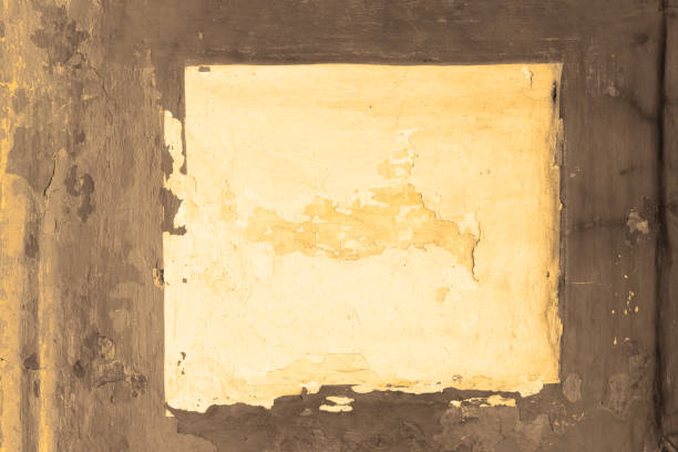 Free space for an inscription. Can be used as a background or poster. Fragment of a wall with bumps and peeling paint.