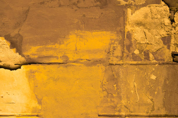 Free space for an inscription. Can be used as a background or poster. Fragment of a wall with bumps and peeling paint.