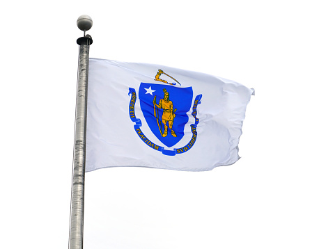 Massachusetts state flag waving on the pole in the wind