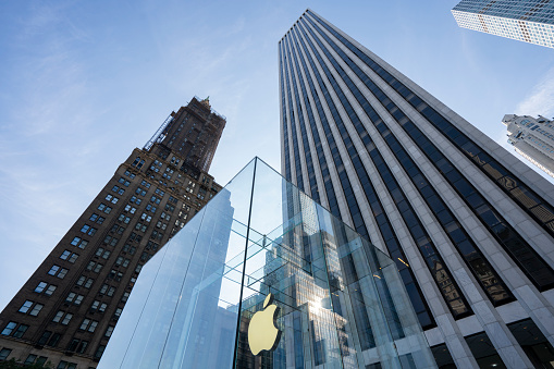 New York, NY, USA - July 9, 2022: Exterior view of the Apple flagship store on the 5th Avenue in NYC. Apple, Inc. is an American multinational tech company headquartered in Cupertino, California.