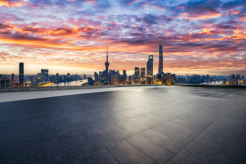 Empty brick floor and city skyline background in summer