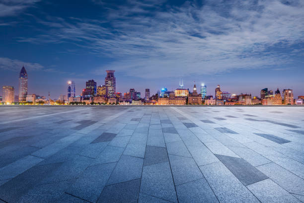 istock Empty brick road and city buildings skyline at night in Shanghai 1891264068