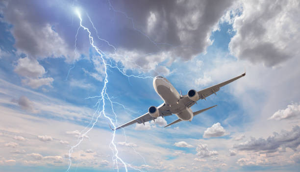 istock Airplane in the sky with thunder and lightning 1891276058