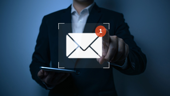 Inbox receiving electronic message alert, Businessman using smart phone with virtual new email notification alert concept for business e-mail communication and digital marketing. internet technology.