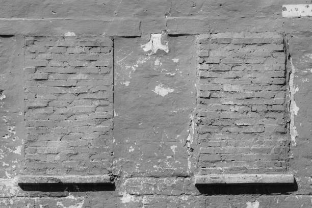 Free space for an inscription. Can be used as a background or poster. Fragment of a wall with bumps and peeling paint.