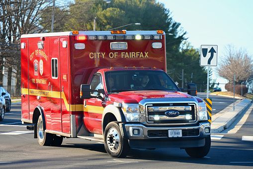 Fairfax, Virginia, USA - December 15, 2023: A City of Fairfax Fire Department paramedic unit races to an accident scene as it responds to an emergency call.