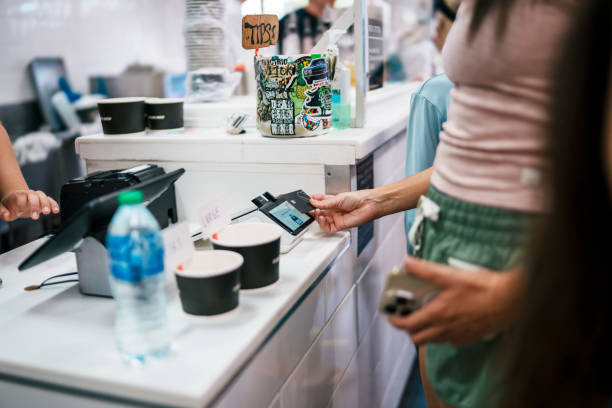 istock Woman paying for shave ice at shop checkout counter 1891413085
