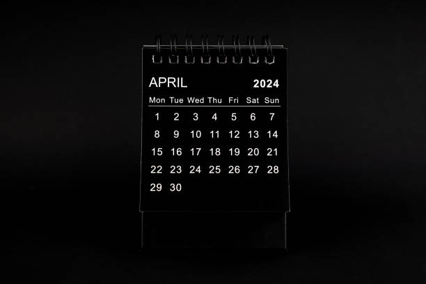 istock Black Calendar for April 2024. Desktop calendar on a black background. 1891434958
