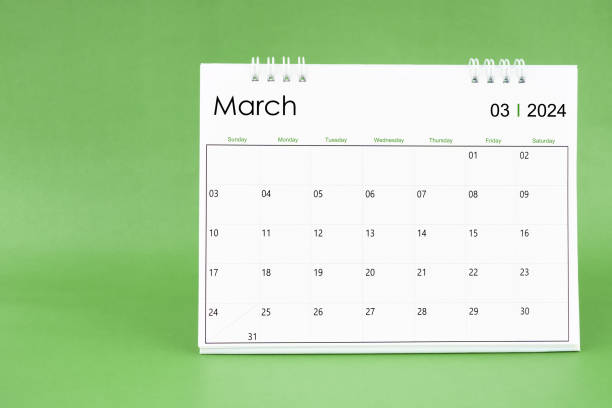 istock March 2024 desk calendar isolated in green background. 1891434959