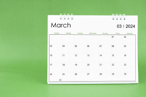 March 2024 desk calendar isolated in green color background.