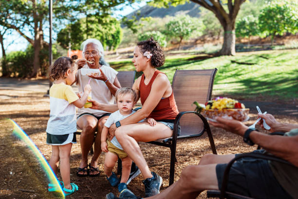 istock Multigenerational family eats a picnic outside 1891441184