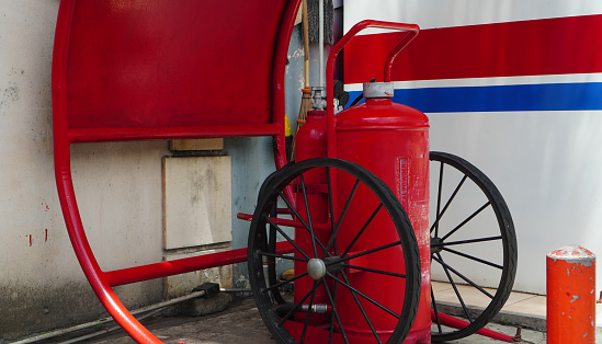 a dry chemical powder type fire extinguisher canister is installed on the stroller