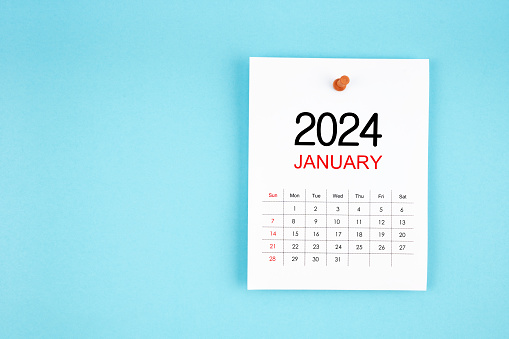 January 2024 calendar page with push pin on blue color background.