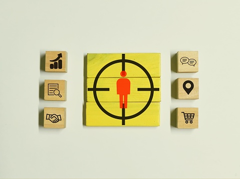 Customer behavior research concept. Wooden blocks with icons.
