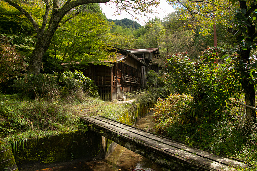 Traditional japanese houses on the Nakasendo trail between Tsumago and Magome in Kiso Valley, Japan..
