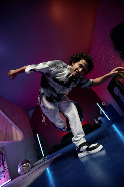 istock Energetic Hip-Hop Dancer Demonstrating Moves on Camera 1891568917