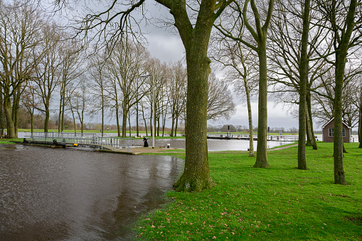 High water level in the river Vecht at the Vechterweerd weir in the Dutch Vechtdal region in Overijssel, The Netherlands. The river is overflowing on the floodplains after heavy rainfal upstream in The Netherlands and Germany in December 2023.
