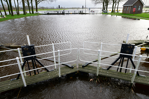 High water level in the river Vecht at the Vechterweerd weir in the Dutch Vechtdal region in Overijssel, The Netherlands. The river is overflowing on the floodplains after heavy rainfal upstream in The Netherlands and Germany in December 2023.