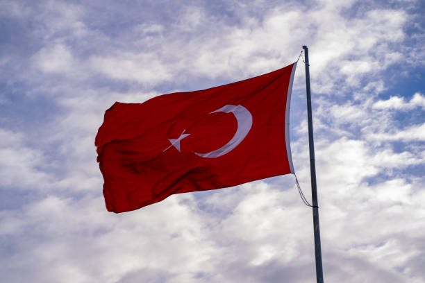 istock Waving Turkish flag and clouds in the background. 1891574721