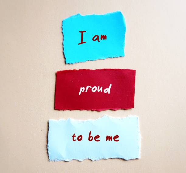 istock Torn paper with handwriting  I AM PROUD TO BE ME, positive  mantra affirmation message to boost self esteem, self acceptance and self compassion 1891576271