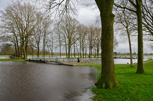 High water level in the river Vecht at the Vechterweerd weir in the Dutch Vechtdal region in Overijssel, The Netherlands. The river is overflowing on the floodplains after heavy rainfal upstream in The Netherlands and Germany in December 2023.