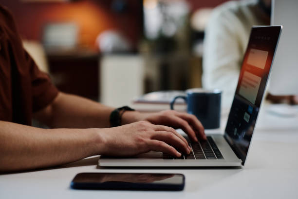 istock Businessman typing on laptop keyboard 1891604083