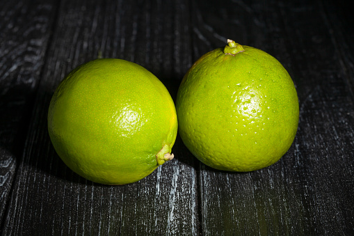 limes on wood background
