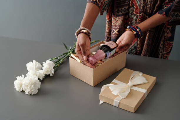 istock Woman putting champagne into box 1891668201