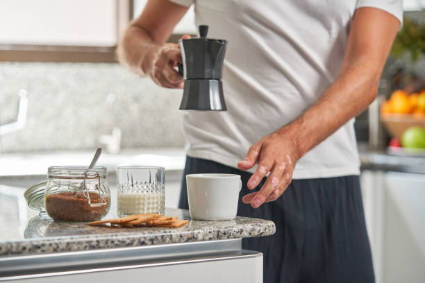 istock Unrecognizable man pouring hot coffee from moka pot 1891758094
