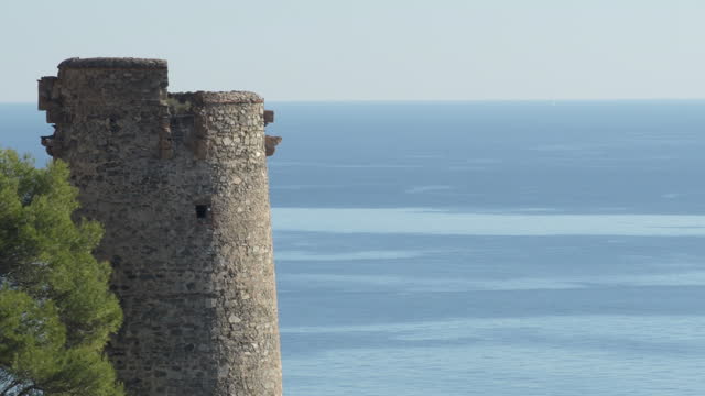 Watchtower of El Pino with blue sea, Nerja, Spain
