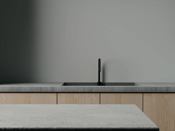 Grey concrete and wood contemporary kitchen tabletop with empty space for your product display over beautiful kitchen and concrete wall background. Minimal elegant trendy kitchen. 3d rendering.