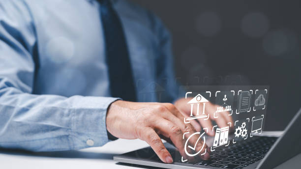 istock Businessman working concept. Business professional, a man working diligently in office, harnesses internet and online communication tools, utilizing his laptop to manage financial data efficiently. 1891840528
