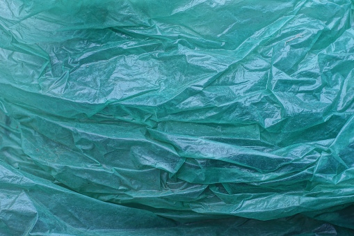 texture of a piece of crumpled green cellophane