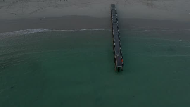 Flying over the reefs and jetty at Peaceful bay during sunset hours.