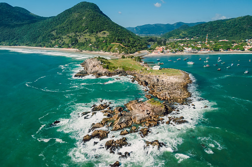 Rocky ocean Coastline, beach and ocean with waves in Brazil. Aerial view of Ponta das Campanhas