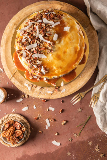 istock Delicious salted caramel cake with pecan nuts and coconut flakes 1891923911