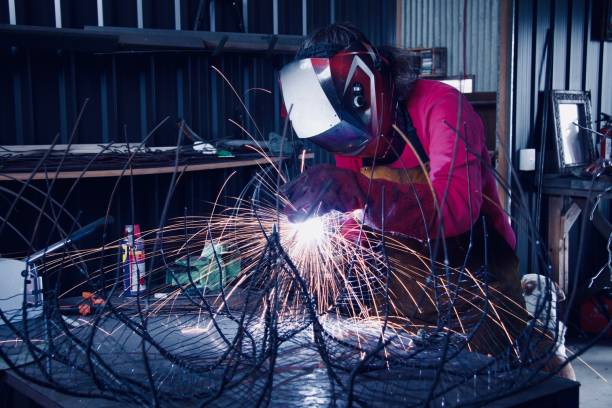 istock Person in a protection helmet doing welding 1891926495