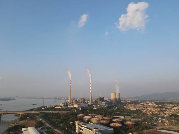istock Power plant with high chimney smoking. 1891985241