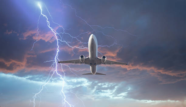 istock Airplane in the sky with thunder and lightning 1892019394