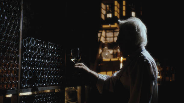 istock Winemaker Analyzing The Quality Of Wine In Glass At A Cellar 1892037506