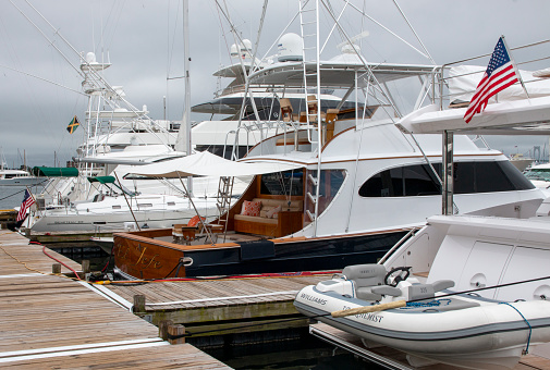 Newport, Rhode Island, USA - 2 July 2021: A bunch of boats that are docked in the water.