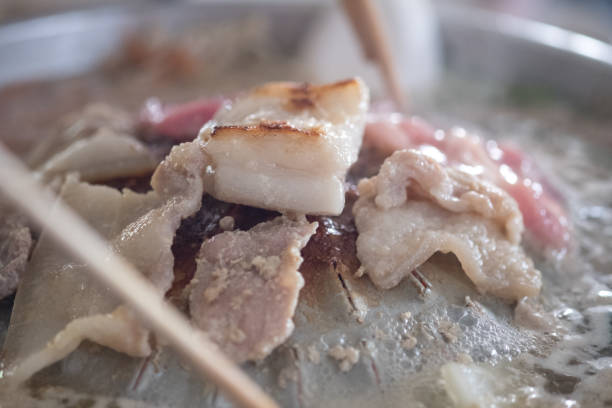 istock Hands are using chopsticks to grilled pork. 1892105833