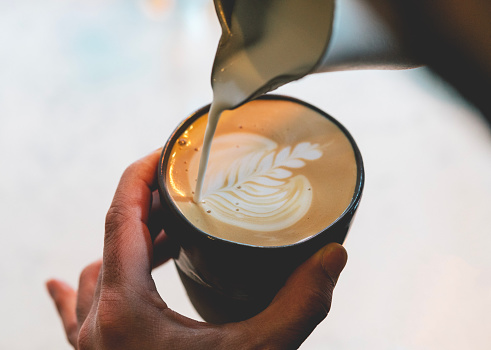 Barista make coffee cup latte art