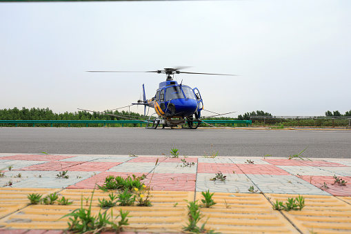 Luannan County, China - June 16, 2019: Agricultural helicopters loaded with pesticides, Luannan County, Hebei Province, China