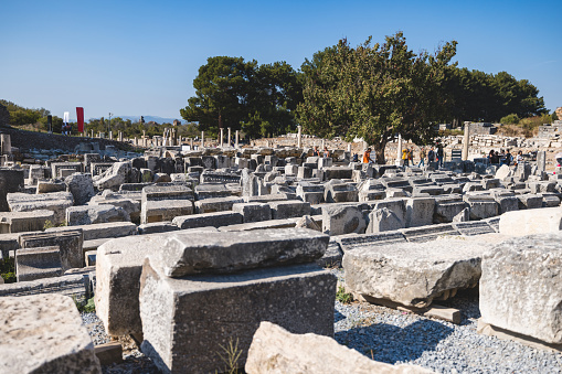 Wide-angle shot of the scattered stone ruins at the ancient Greek Agora in Ephesus, showcasing historical architecture.