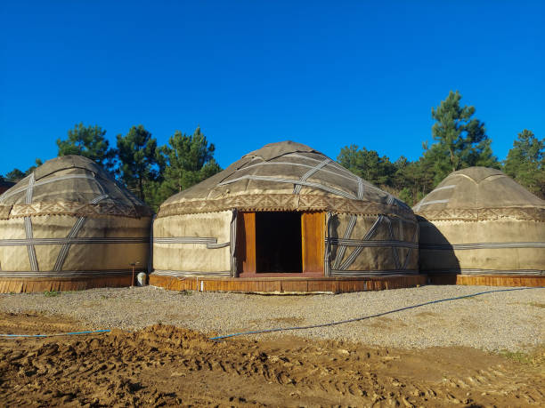 istock 3 large white traditional tents on sand ground 1892190120