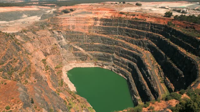 drone shot revealing a mine pit in Western Australia