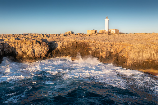 Summer Capo Murro di Porco old abandoned lighthouse - Syracuse, Sicily, Italy, Mediterranean sea.\nA beautiful sunny day by the seashore. An active holiday.