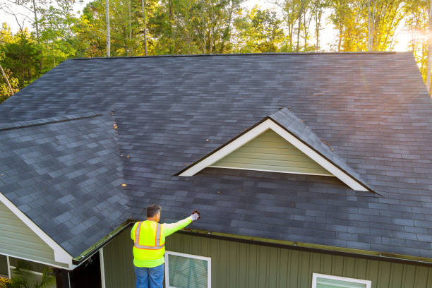istock As worker is cleaning clogged roof gutter drain from dirt, debris, fallen leaves 1892303861